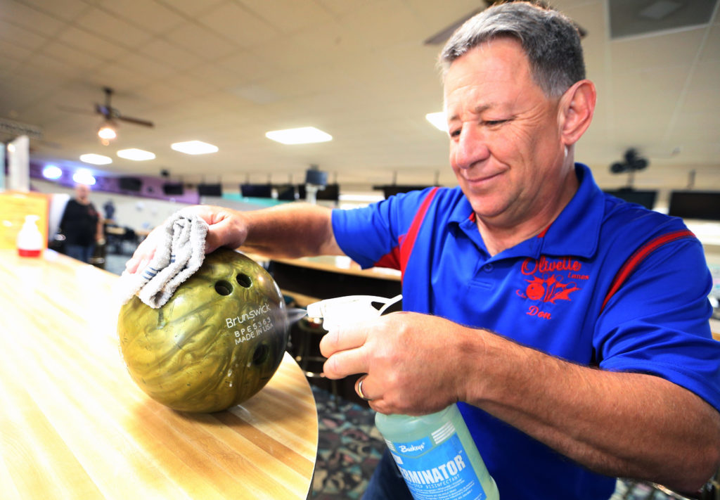 Don Klackner Sanitizes a Bowling Ball