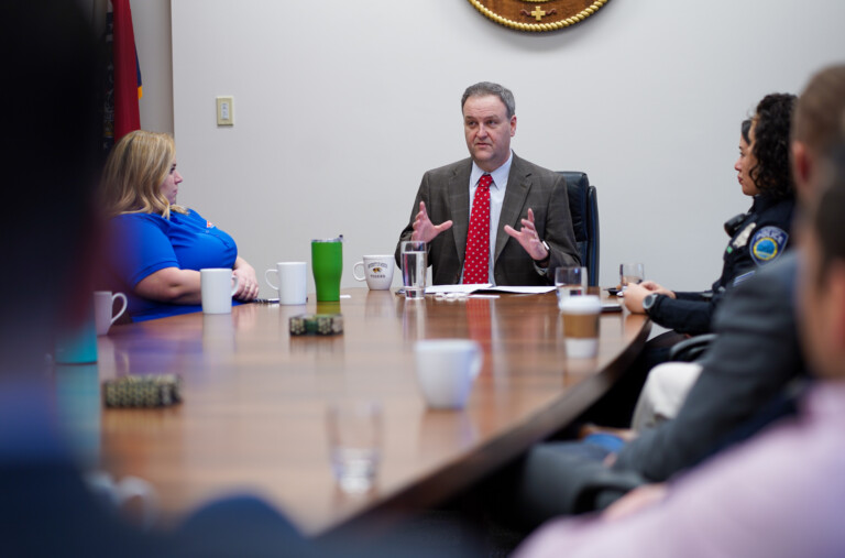 Dr Sam Page, County Executive St Louis, at table