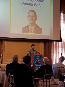 Don Pohl on slide & Ranken student giving thank you speech at podium 4-14-22